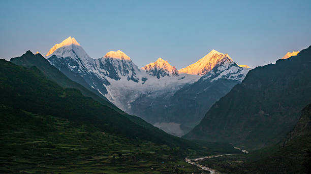 istock Panchachuli peaks during sunrise. Golden sunlight falling on snow covered Himalayan mountains as seen from darma valley uttarakhand. 2207647996