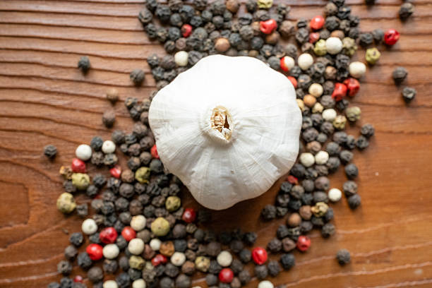 Garlic braid on old wooden background