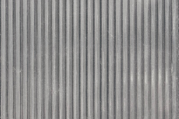 istock Zinc sheet wave texture. closed up silver zinc plate small wavy pattern texture clean new background 2207657601