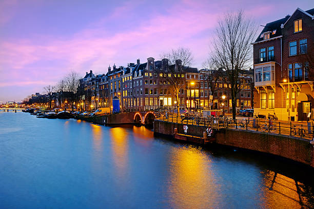 istock View on Amsterdam at the river Amstel at sunset in the Netherlands 2207658496