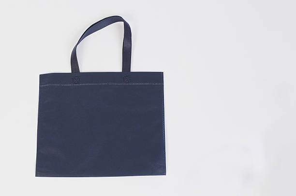 istock Spunbond bag in navy blue color isolated on white background. 2207658498