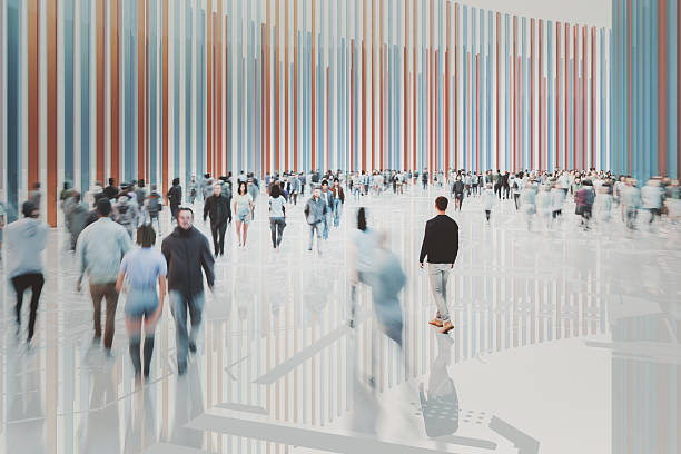 istock Young man walking in crowds of people 2207660464