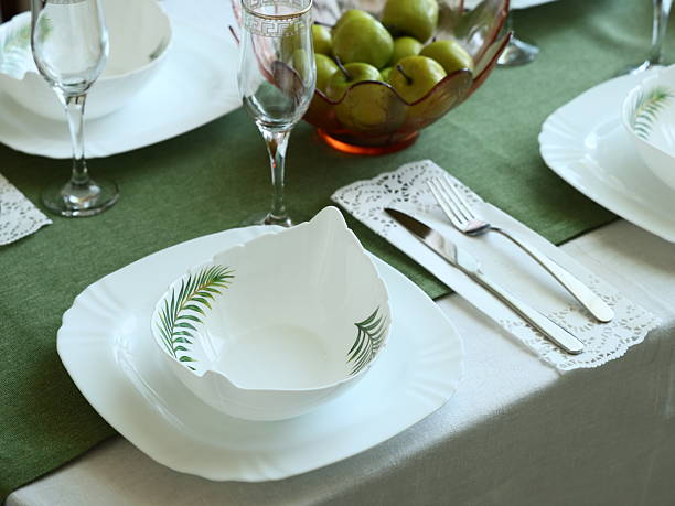 istock An Elegant Dining Table Setting Enhanced with Green Accents and Vibrant Fresh Fruits 2207660759