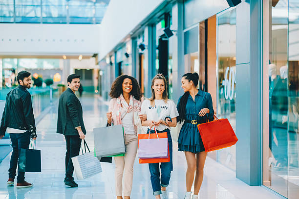 istock Stylish women shopping in a modern mall 2207660763