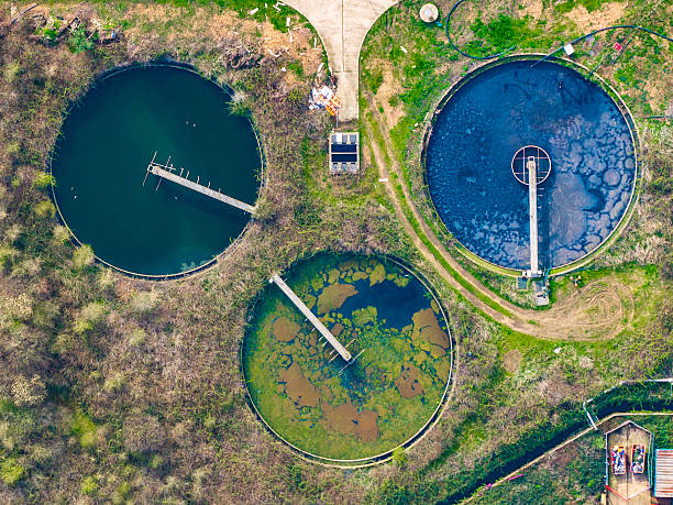 Drone capturing water treatment plant in rural landscape