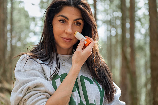 istock Woman applying spf sun stick in the summer mountain 2207662601