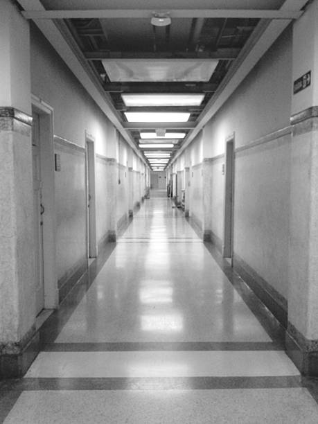 istock Long and Symmetrical Corridor in Black and White 2207662902