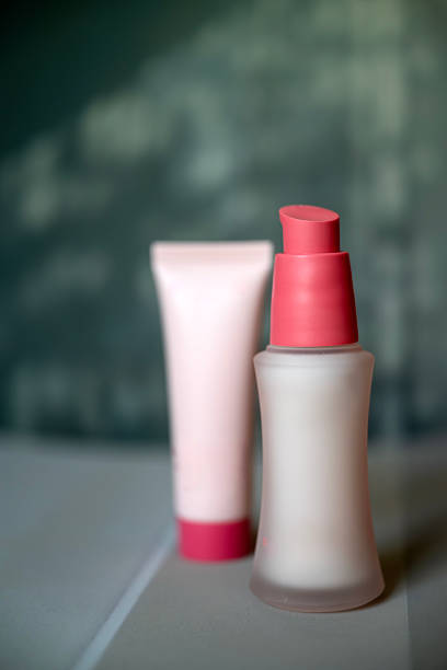 Anti aging face serum and cream on shadows background