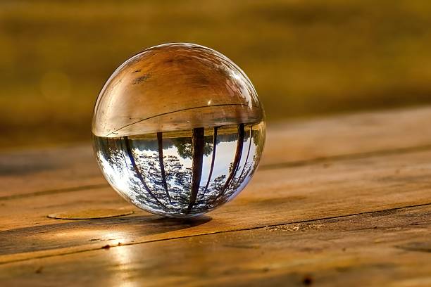 istock Glass ball on a table in the forest. Concept. Ecology. Selective focus. 2207666134