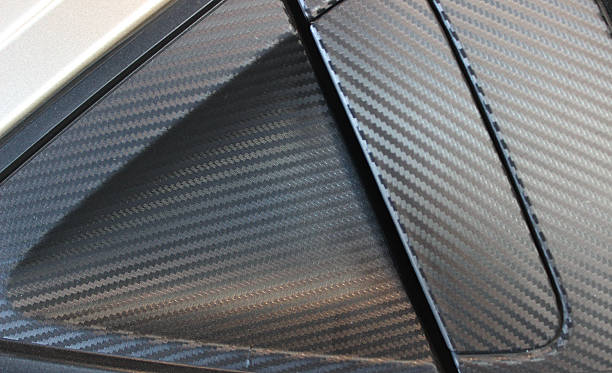 istock External car door handle covered with protective film with carbon texture 2207666341