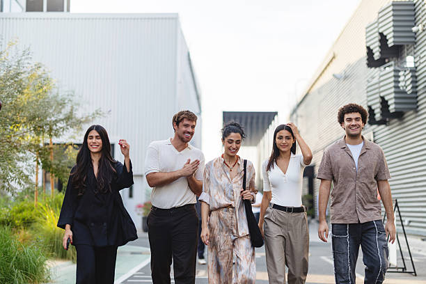 istock Multicultural Young Professionals Walking Together Through Modern Dubai Business District 2207667231