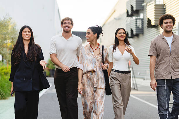 istock Multicultural Young Professionals Walking Together On Modern Urban Street 2207667233