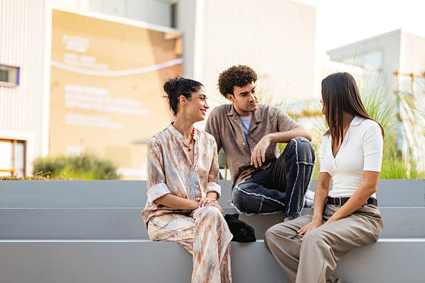 istock Diverse Young Adults Socializing Outdoors in Sunny Dubai Urban Setting 2207667260