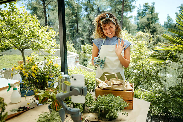 istock Young woman vlogging her backyard gardening adventure 2207667550