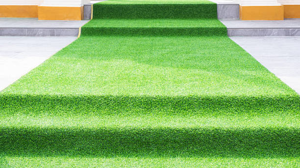 istock Decorate different level walkway with artificial grass on stairs and patio for outdoors event 2207668387