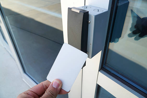istock using white entrance card at door entrance card reader 2207668707