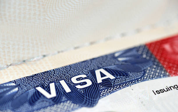 istock close up on USA visa on the passport 2207668754