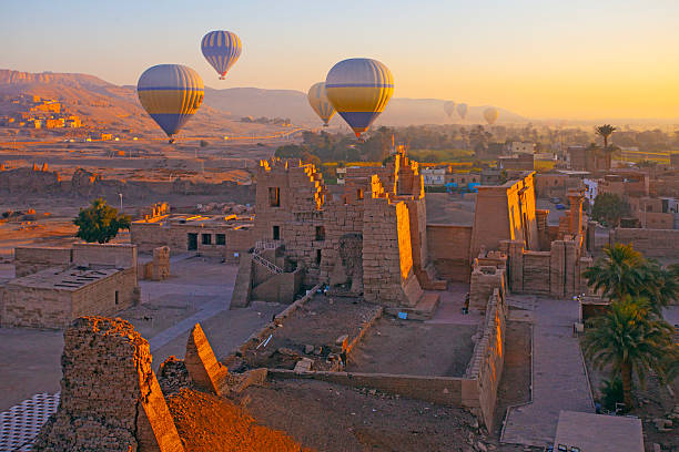 Hot air balloon flying above The Mortuary Temple of Ramesses III at Medinet Habu in Theban Necropolis at Valley of the Kings, Loxor, Egypt Luxor, Egypt - March 15 , 2025: Hot air balloon flying above The Mortuary Temple of Ramesses III at Medinet Habu in Theban Necropolis at Valley of the Kings, Loxor, Egypt ramses i stock pictures, royalty-free photos & images