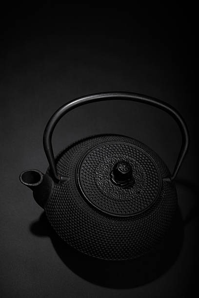istock Black matal teapon on black background 2207673101