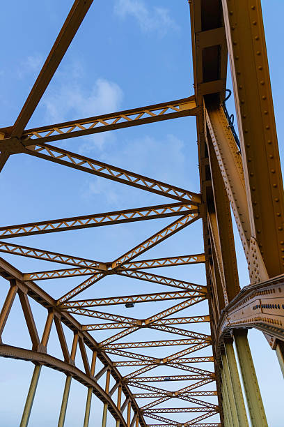 istock Metal bridge structure showcases intricate design and engineering beneath a clear blue sky in the early morning light, emphasizing the craftsmanship involved 2207673455