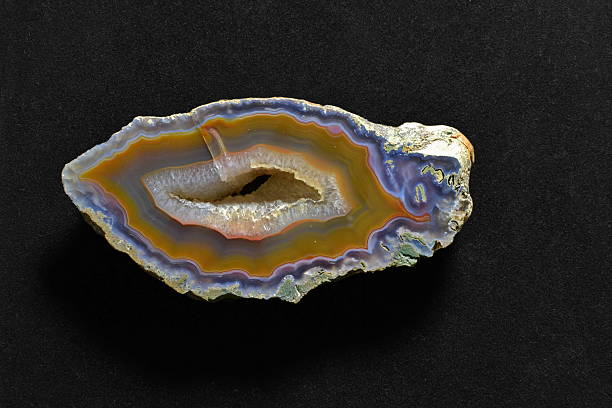 istock Beautiful semi-precious stone agate, mineral, stone, close-up on black background. 2207675946