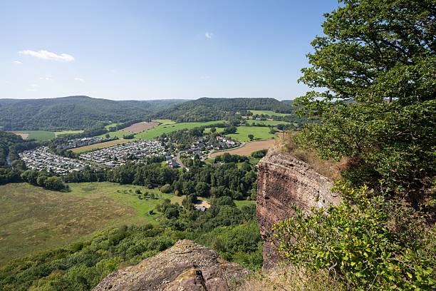 istock Scenic view from a rocky cliff over a lush valley. 2207679285