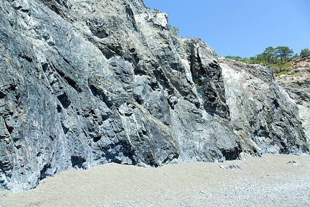 plastic molding in the shape of a rock with stones for climbing in the school yard. soft impact surface