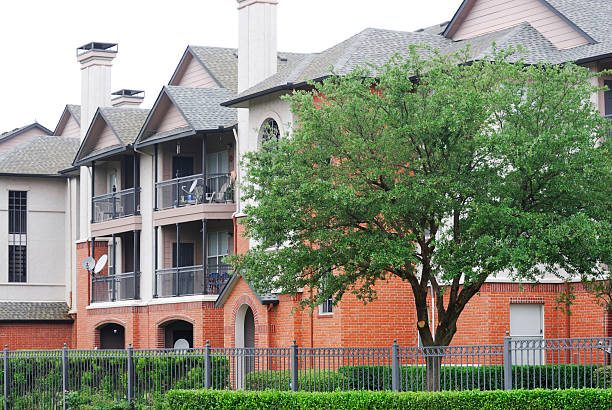 apartment building with spring trees landscape