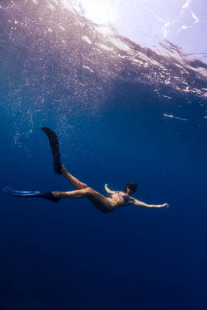 istock Beautiful woman diving underwater 2207685015
