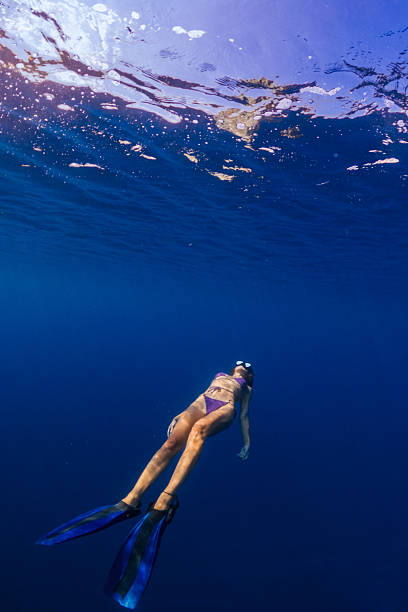 istock Beautiful woman diving underwater 2207685019