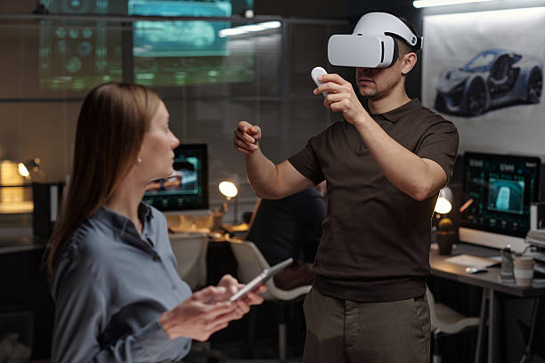 istock Young male engineer wearing VR headset 2207685091