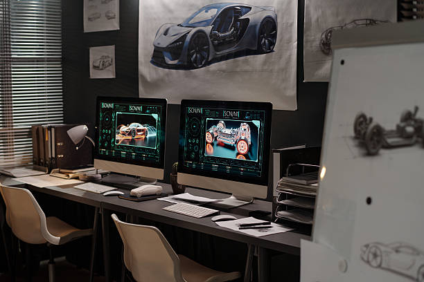 istock Computers with graphic cars on screens 2207685148