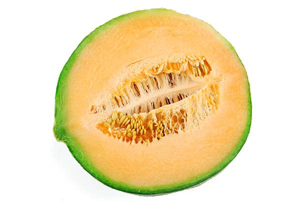 istock close up on fresh melon cut in half isolated on white background 2207685431