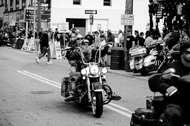 Riders and event goers at the 2025 Daytona Bike Week. The event is held every March in Daytona Beach, FL. Motorcycle Enthusiasts come from around the world for this week long event. All types of motorcycles are allowed from custom Harley Davidson to scooters. The people who walk the streets enjoying the event provide as much entertainment as the motorcycles themselves.