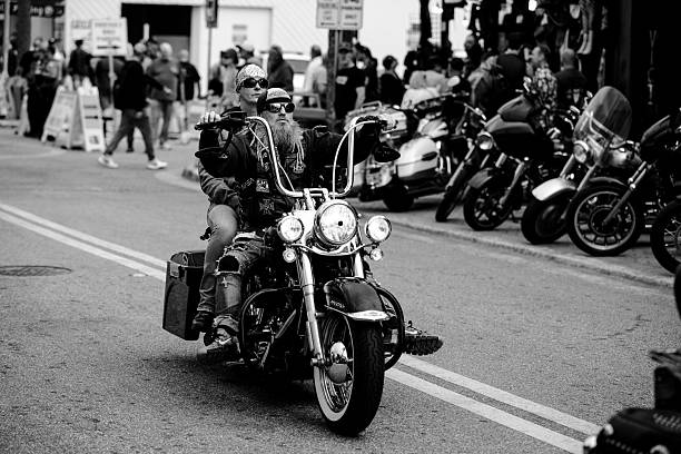Riders and event goers at the 2025 Daytona Bike Week. The event is held every March in Daytona Beach, FL. Motorcycle Enthusiasts come from around the world for this week long event. All types of motorcycles are allowed from custom Harley Davidson to scooters. The people who walk the streets enjoying the event provide as much entertainment as the motorcycles themselves.