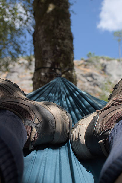 istock Point of View from Hammock with Hiking Boots in Forest 2207689936