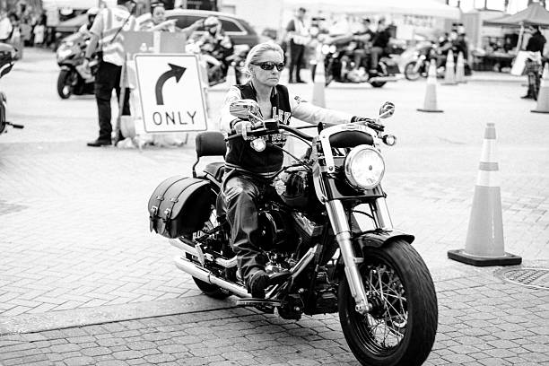 Riders and event goers at the 2025 Daytona Bike Week. The event is held every March in Daytona Beach, FL. Motorcycle Enthusiasts come from around the world for this week long event. All types of motorcycles are allowed from custom Harley Davidson to scooters. The people who walk the streets enjoying the event provide as much entertainment as the motorcycles themselves.