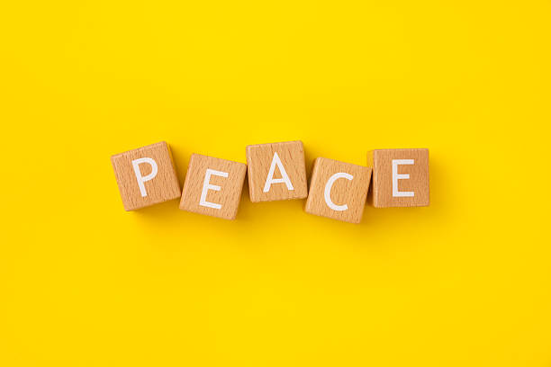istock Block Words with Peace on a Yellow Background 2207695306