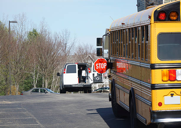 istock school bus parked in residential community 2207699065