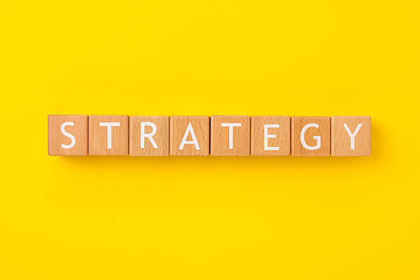 istock Block Words with Strategy on a Yellow Background 2207699191