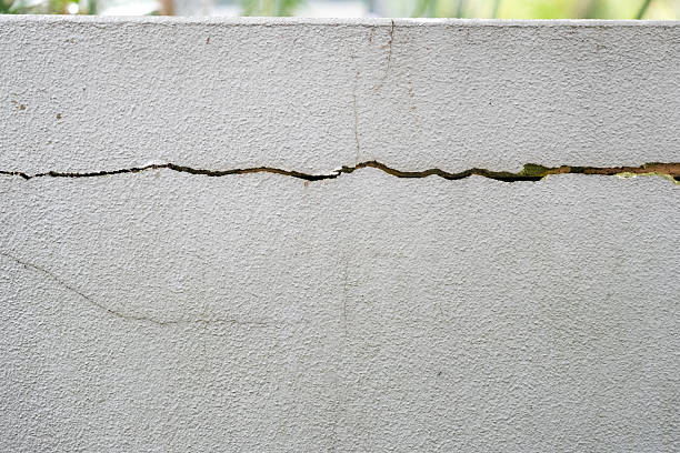istock A weathered concrete surface showcasing textured and rugged details such as a crack 2207701905