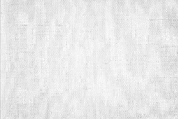 istock White color fabric canvas woven texture background in pattern light blank. Natural gauze linen, carpet wool and cotton cloth textile textured as clean empty for decoration text. Grey sack material. 2207702652