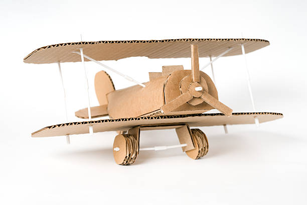 istock Creative DIY biplane made of cardboard, hand-crafted airplane model 2207702844