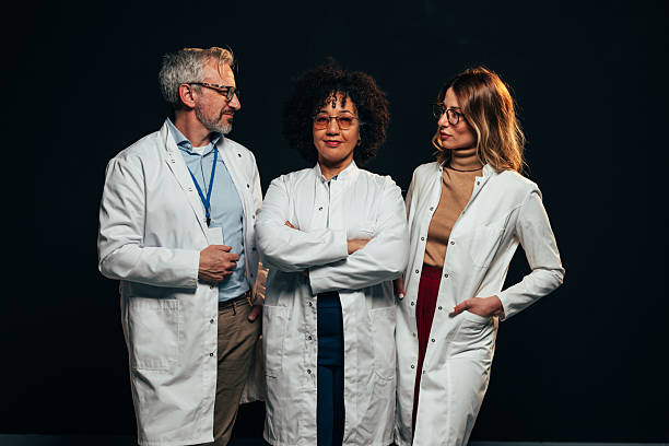 istock Confident medical team posing together on black background 2207702958
