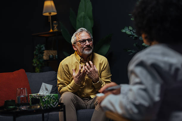 istock Senior man talking to his therapist during therapy session 2207702985