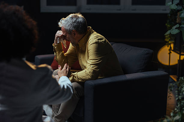 istock Mature man crying during therapy session with psychologist 2207703002