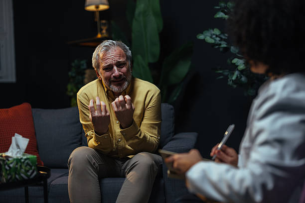 istock Desperate mature man talking with psychologist on therapy session 2207703005