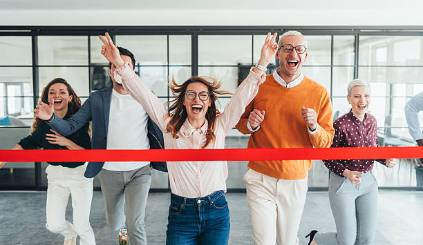 istock Team Celebration Crossing the Finish Line in an Office Setting 2207703537