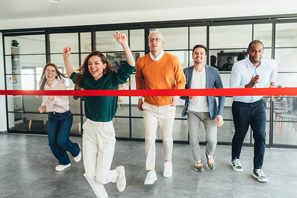 istock Team Celebration Crossing the Finish Line in an Office Setting 2207703538