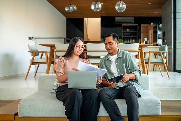 istock Business Discussion at Home with Laptop and Tablet 2207703587